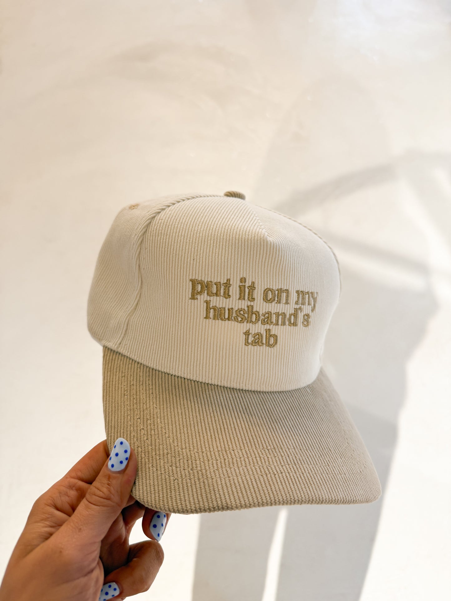 put it on my husbands tab hat
