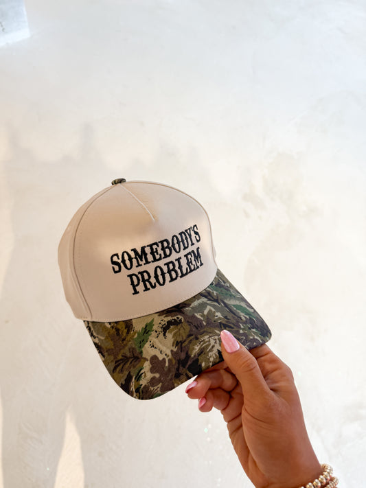 somebodys problem hat